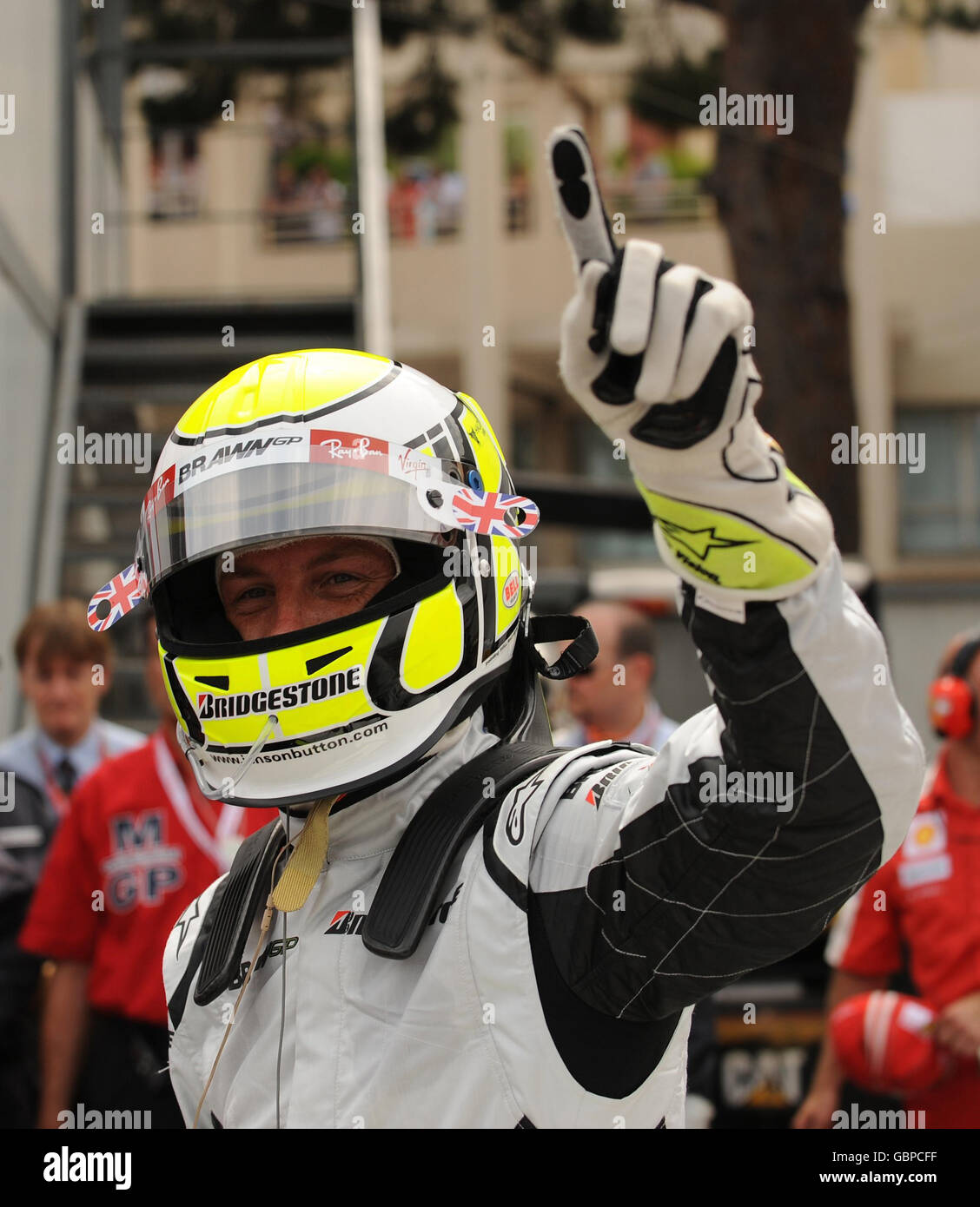 Brawn GP s Jenson Button celebrates his pole position during a