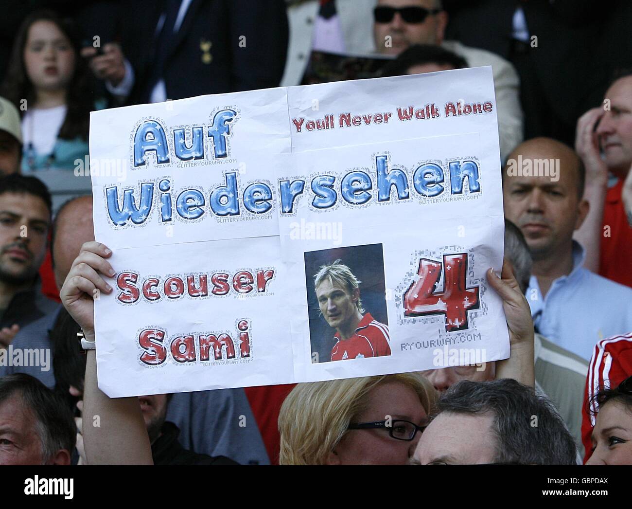 A Liverpool fan unveils a banner in the stands in honour of Liverpool's Sami Hyypia reading Auf Wiedersehen Scouser Sami Stock Photo