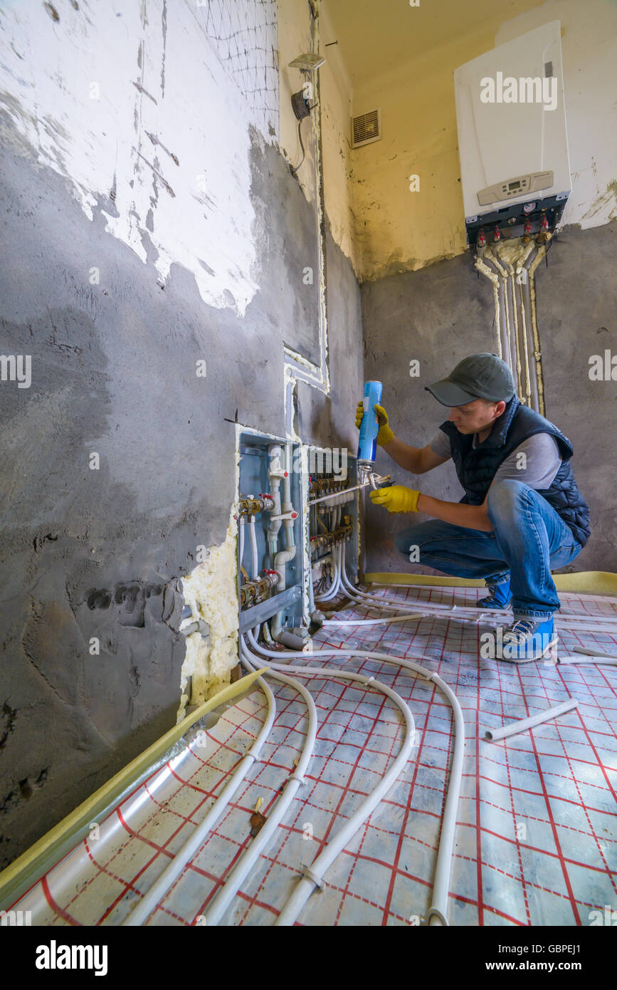 pipefitter installing system of heating Stock Photo