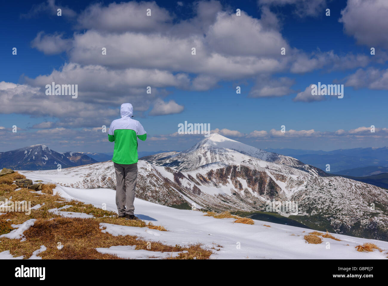 alone tourist in high mountain Stock Photo