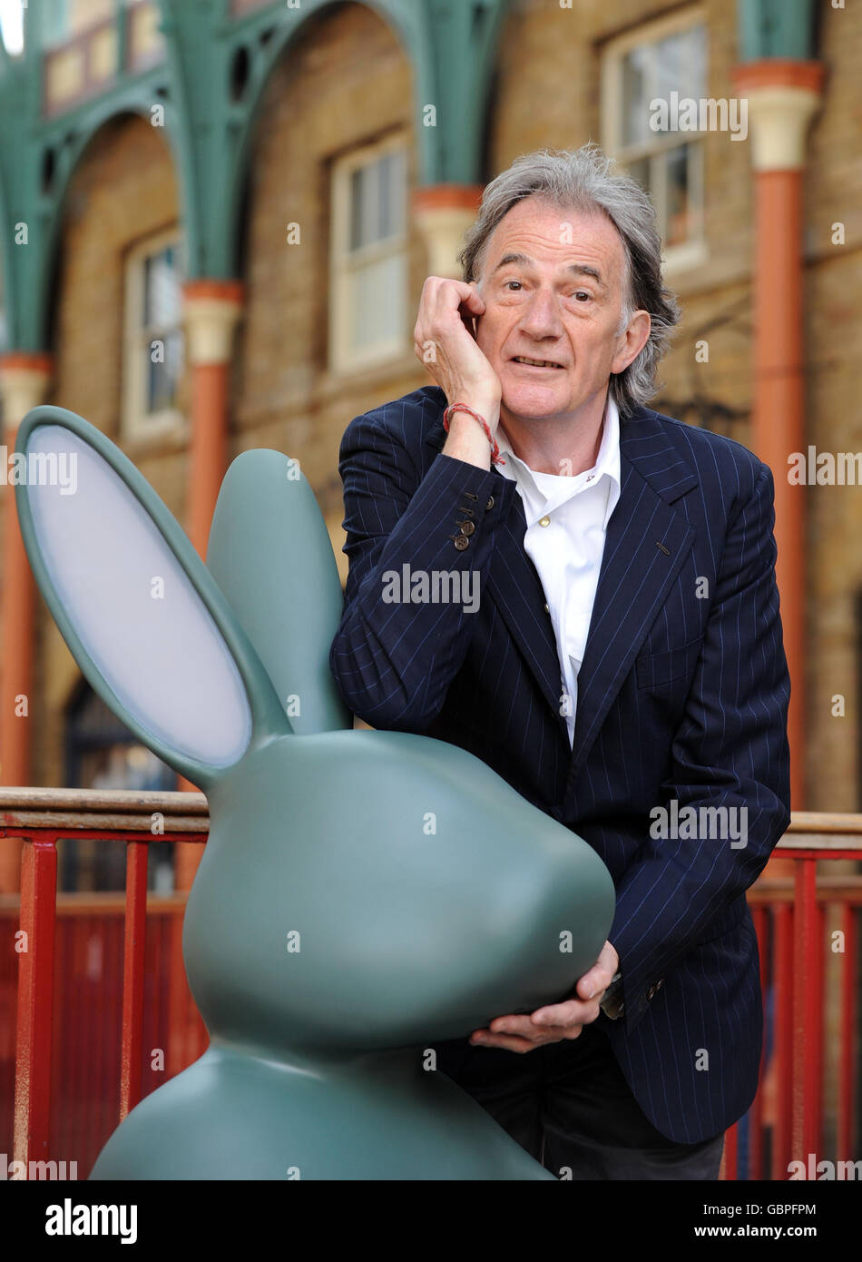 British fashion designer Paul Smith unveils the new London rubbish bin. The  giant rabbit 'Bunny Bin' has ears that light up when anyone puts rubbish  into it in central London Stock Photo -