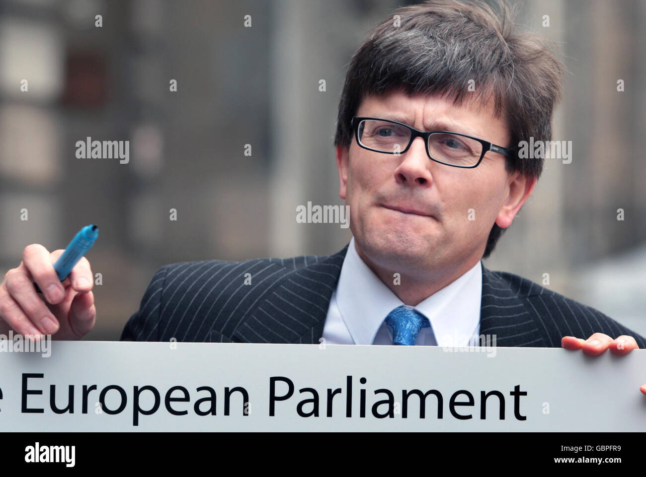 Andy O'Neill, head of the Electoral Commission in Scotland holds up a
