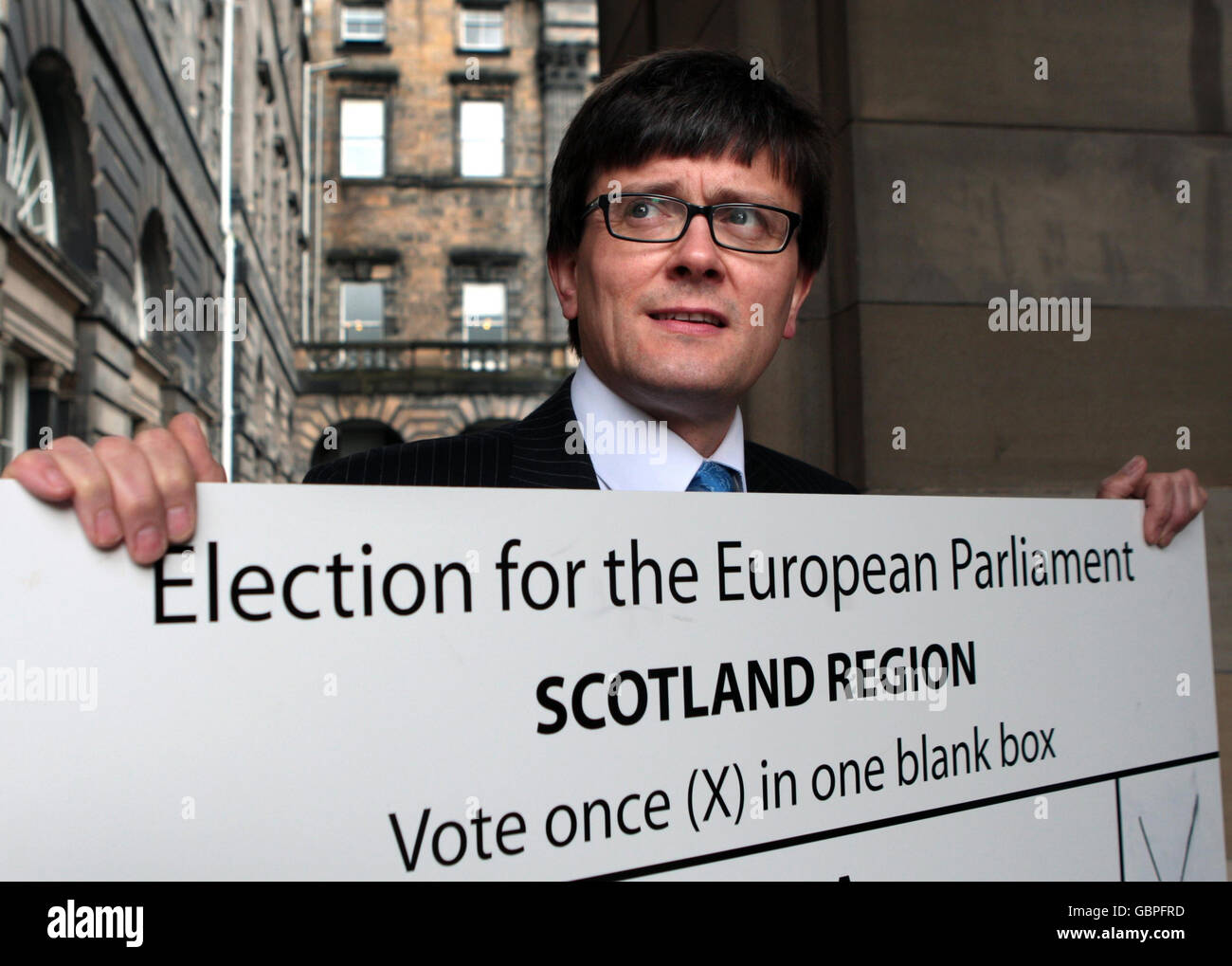 Andy O'Neill, head of the Electoral Commission in Scotland holds up a