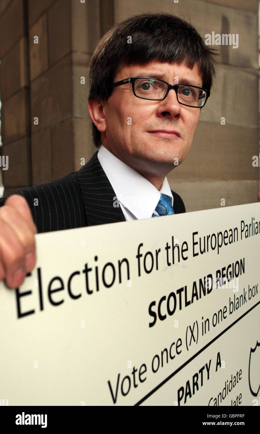 Andy O'Neill, head of the Electoral Commission in Scotland holds up a