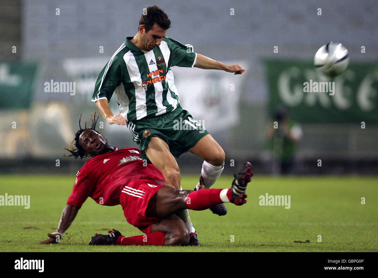 Soccer - UEFA Cup - Second Qualifying Round - First Leg - Rapid Vienna v FC Rubin Kazan. FC Rubin Kazan's Macbeth Sibaya (l) slides in to tackle Rapid Vienna's Florian Sturm Stock Photo