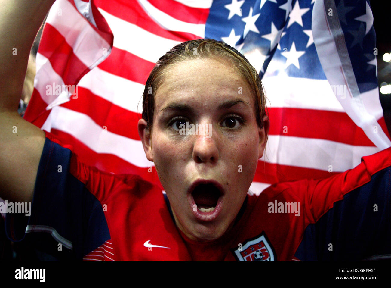 Soccer - Athens Olympic Games 2004 - Women's Final - USA v Brazil. USA's Brandi Chastain is excited about winning the gold medal and celebrates with the american flag Stock Photo