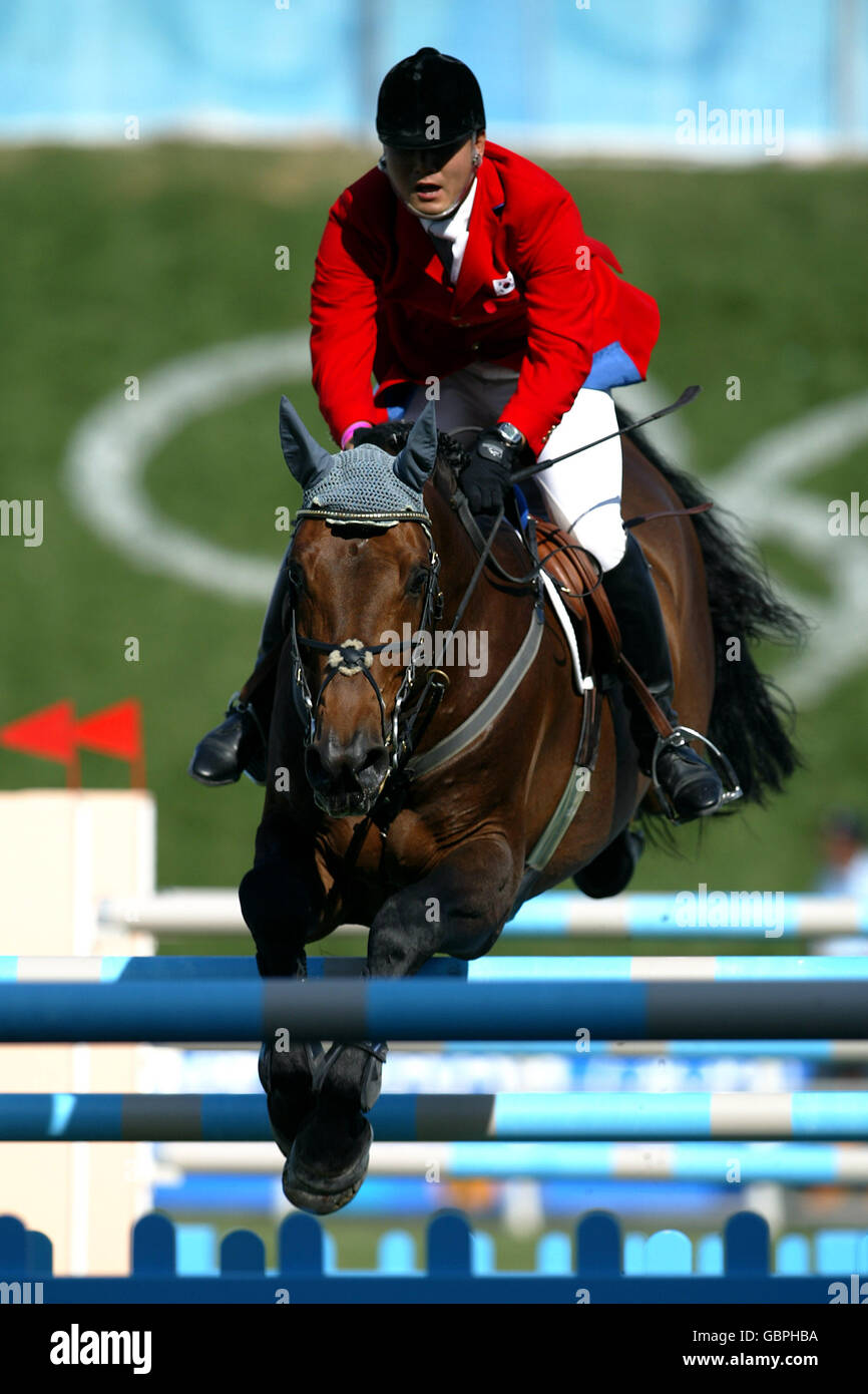 Equestrian - Athens Olympic Games 2004 - Jumping - Individual Round A. Korea's Soon-Won Hwang in action on C.Chap Stock Photo