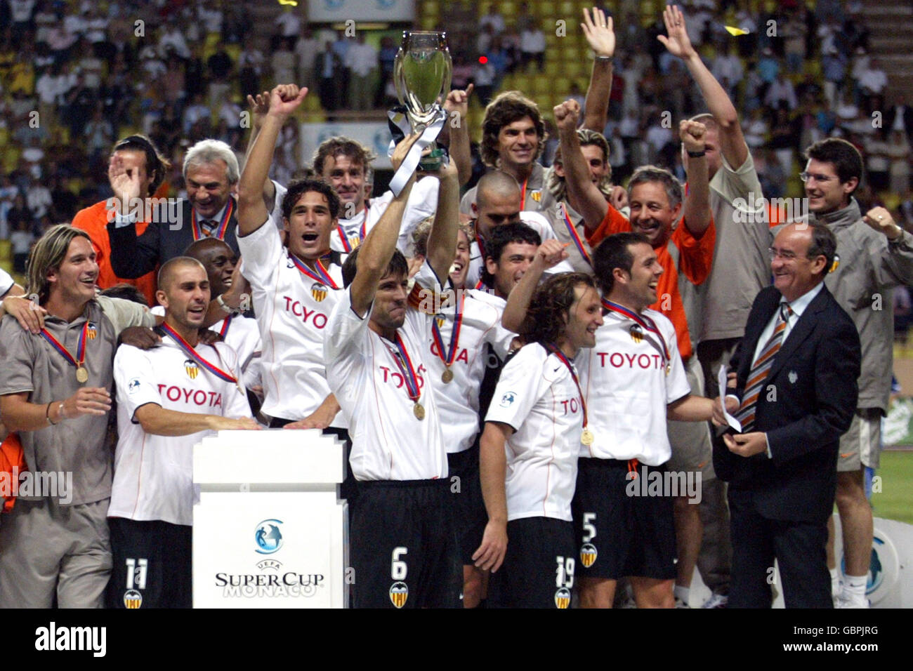 Valencia players celebrate with the uefa super cup trophy hires stock
