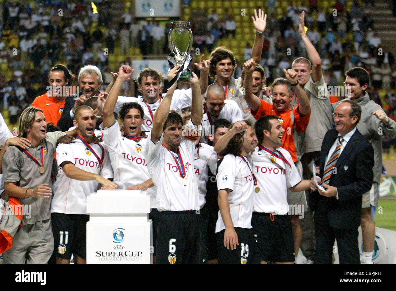Valencia players celebrate with the uefa super cup trophy hires stock