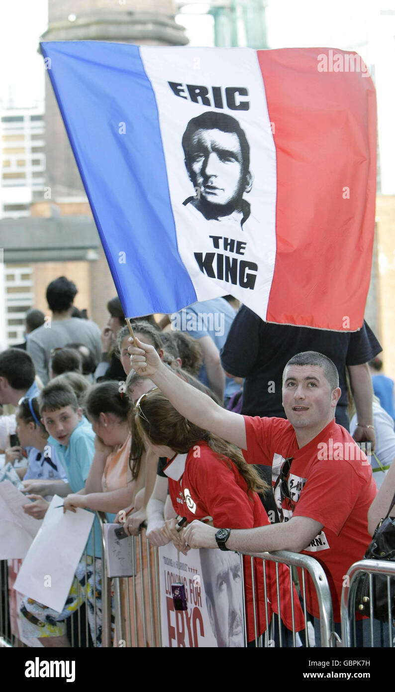 A fan of Eric Cantona waves a flag at the Irish film premiere of 'Looking For Eric' at the lighthouse cinema in Dublin. Stock Photo