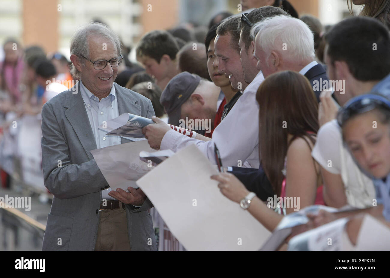 Director Ken Loach signs autographs as he arrives for the Irish film premiere of 'Looking For Eric' at the lighthouse cinema in Dublin. Stock Photo