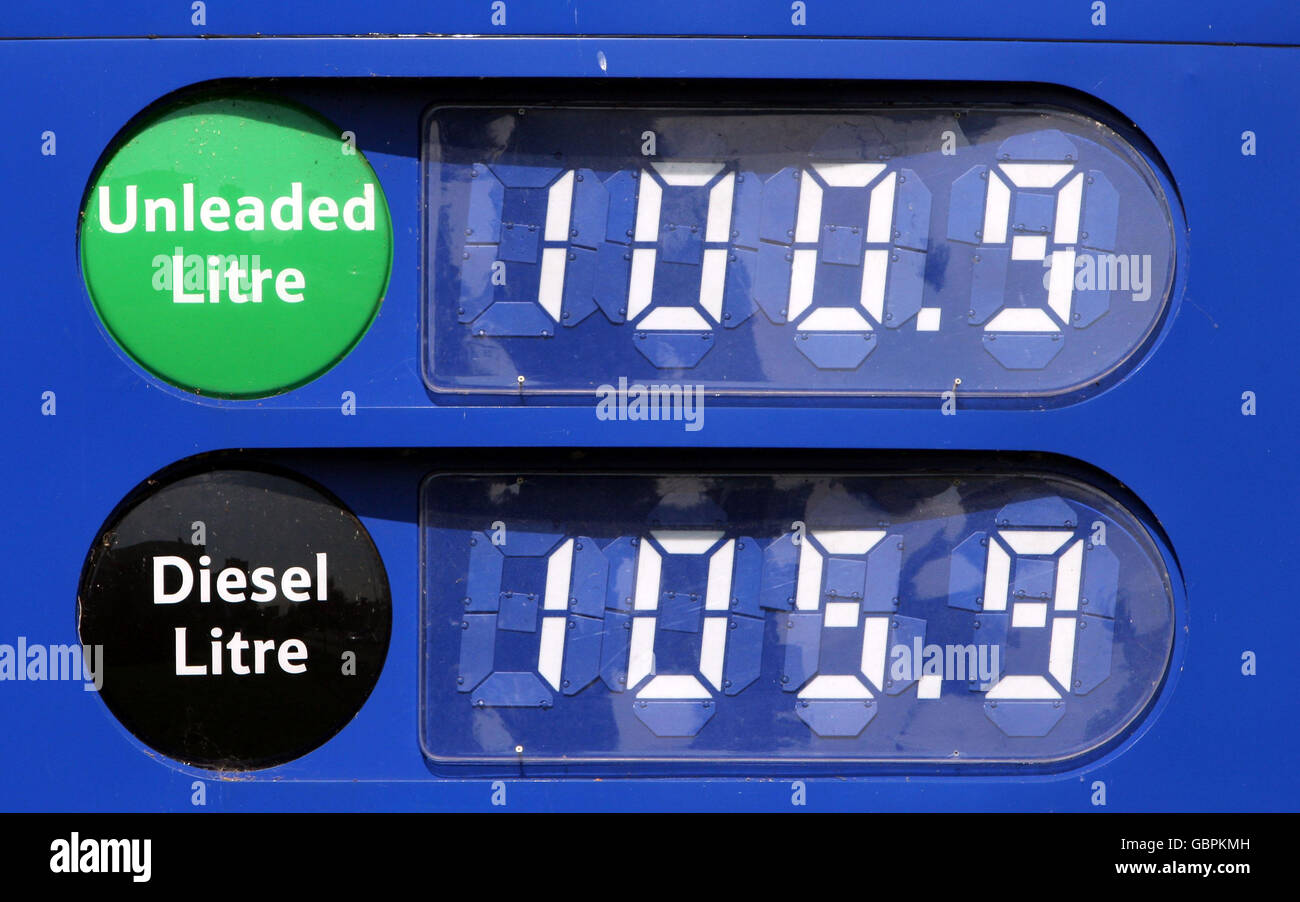 A sign showing current fuel prices at a Tesco superstore in Sunbury, Surrey. More than half of drivers have begun to cut back on their motoring and other spending as average petrol prices rise above 1 a litre again, an AA/Populus poll revealed today. Stock Photo