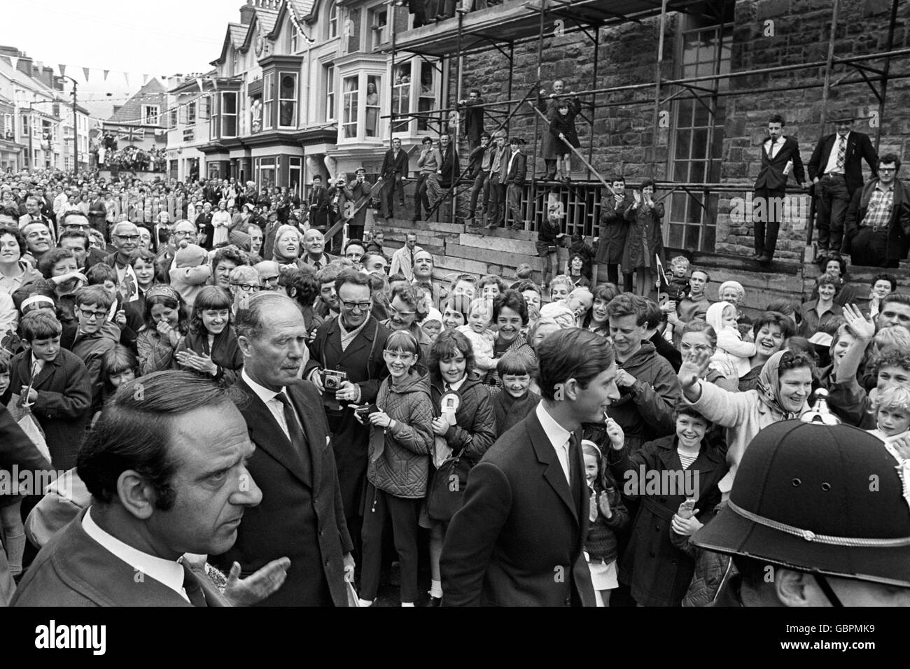 The Prince of Wales walking through crowded Queen's Square in Blaenau Festiniog, as he was given a smiling welcome by the townspeople, on the first day of his meet-the-people tour of Wales. Stock Photo