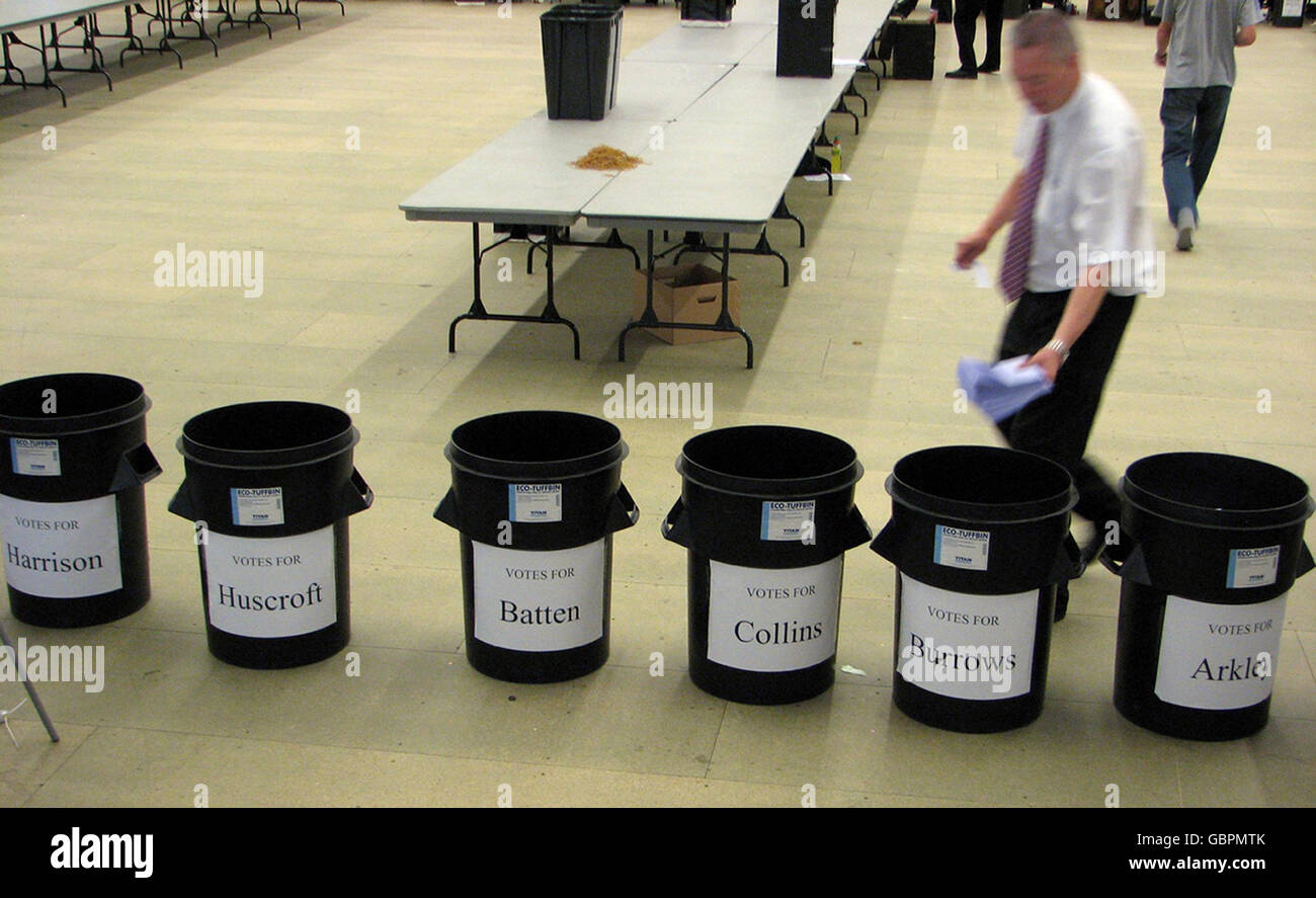 A council worker drops ballot papers into the bin for one of the candidates in the election for the Mayor of North Tyneside. Stock Photo