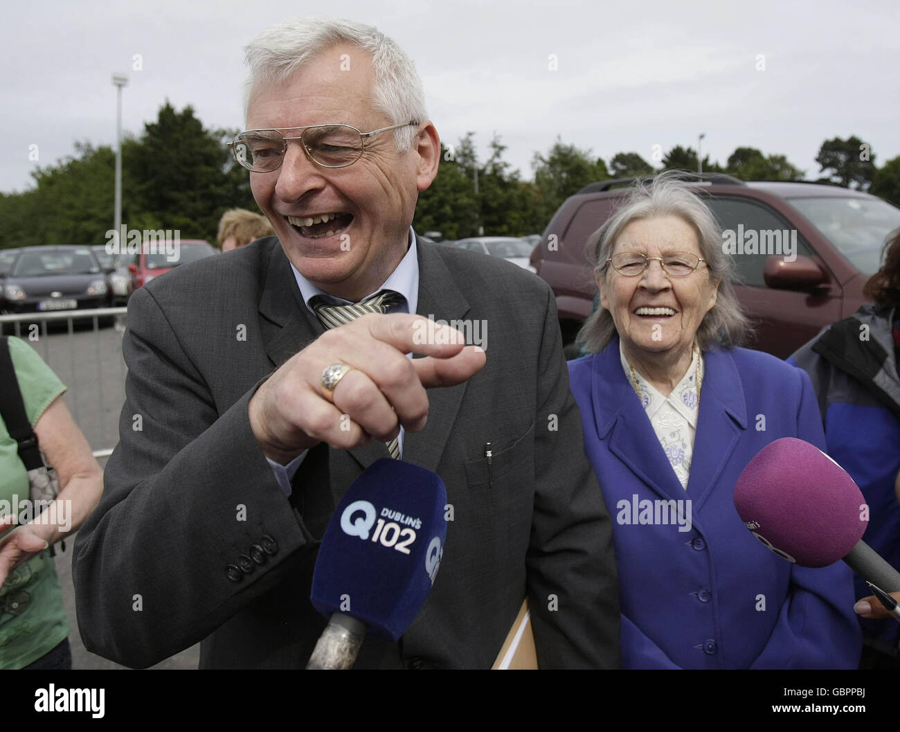 Socialist party candidate Joe Higgins arrives with his mother Ellen as counting continues in the European elections at the RDS centre in Ballsbridge, Dublin. Stock Photo