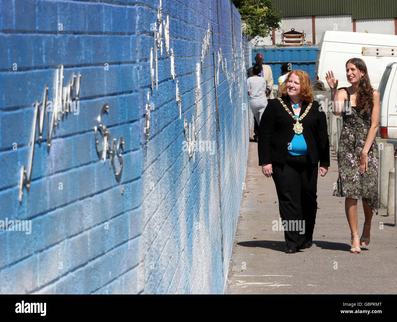 Lord Mayor of Belfast Naomi Long (Left) is shown the new art work in Conway Street Belfast, by artist Daniela Balmaverde (right). Stock Photo