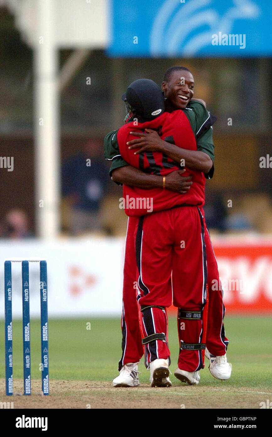 Cricket - ICC Champions Trophy 2004 - England v Zimbabwe. Zimbabwe's Vusimuzi Sibanda is congratulated on capturing the wicket of England's Vikram Solanki by his captain Tatenda Taibu Stock Photo
