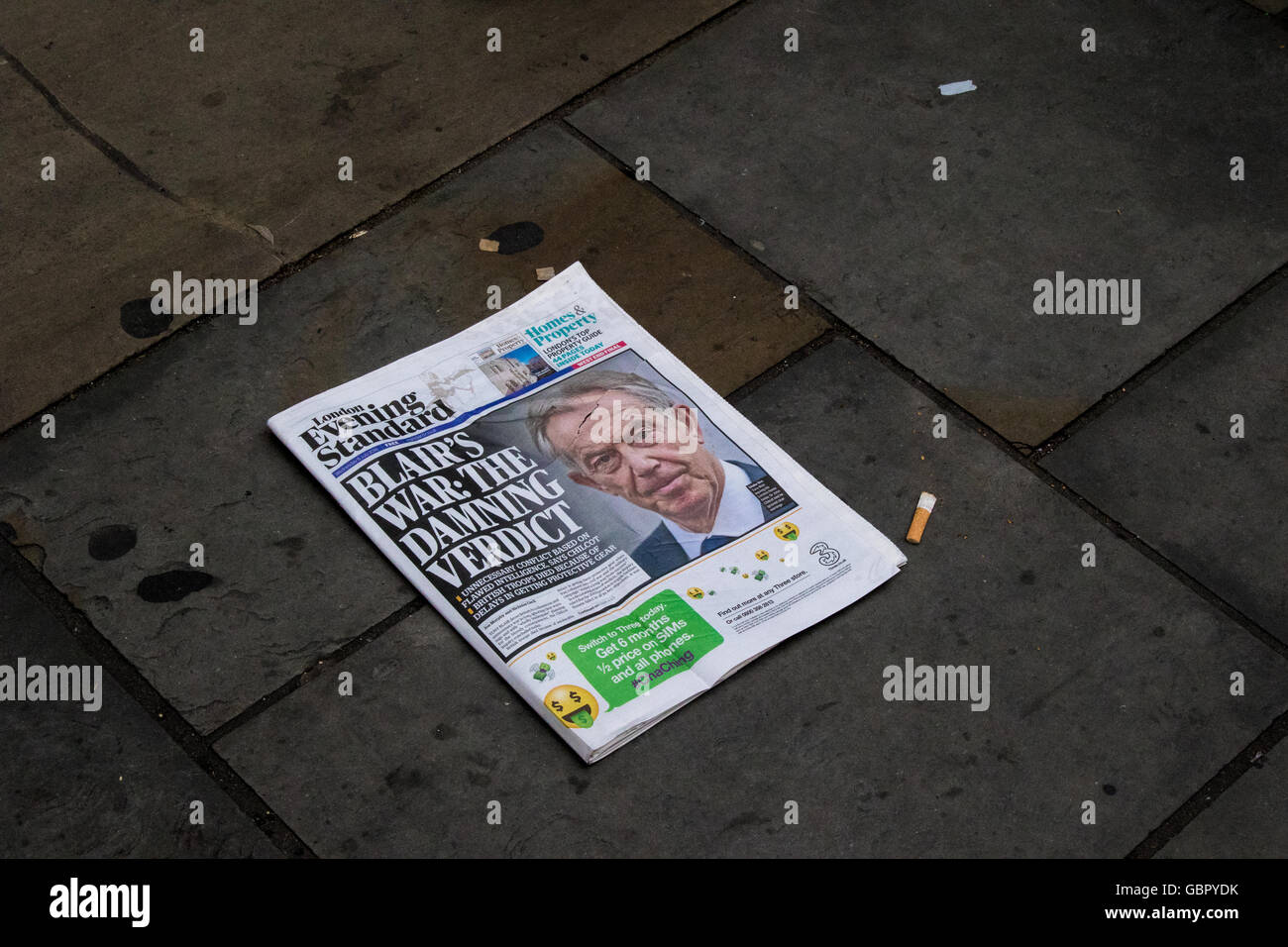 London, UK. 6th July, 2016. An evening newspaper lies discarded in the street. Former Prime Minister Tony Blair is back in the headlines as Chilcot enquiry outcome is published. Kate Muggleton/Alamy Live News Stock Photo
