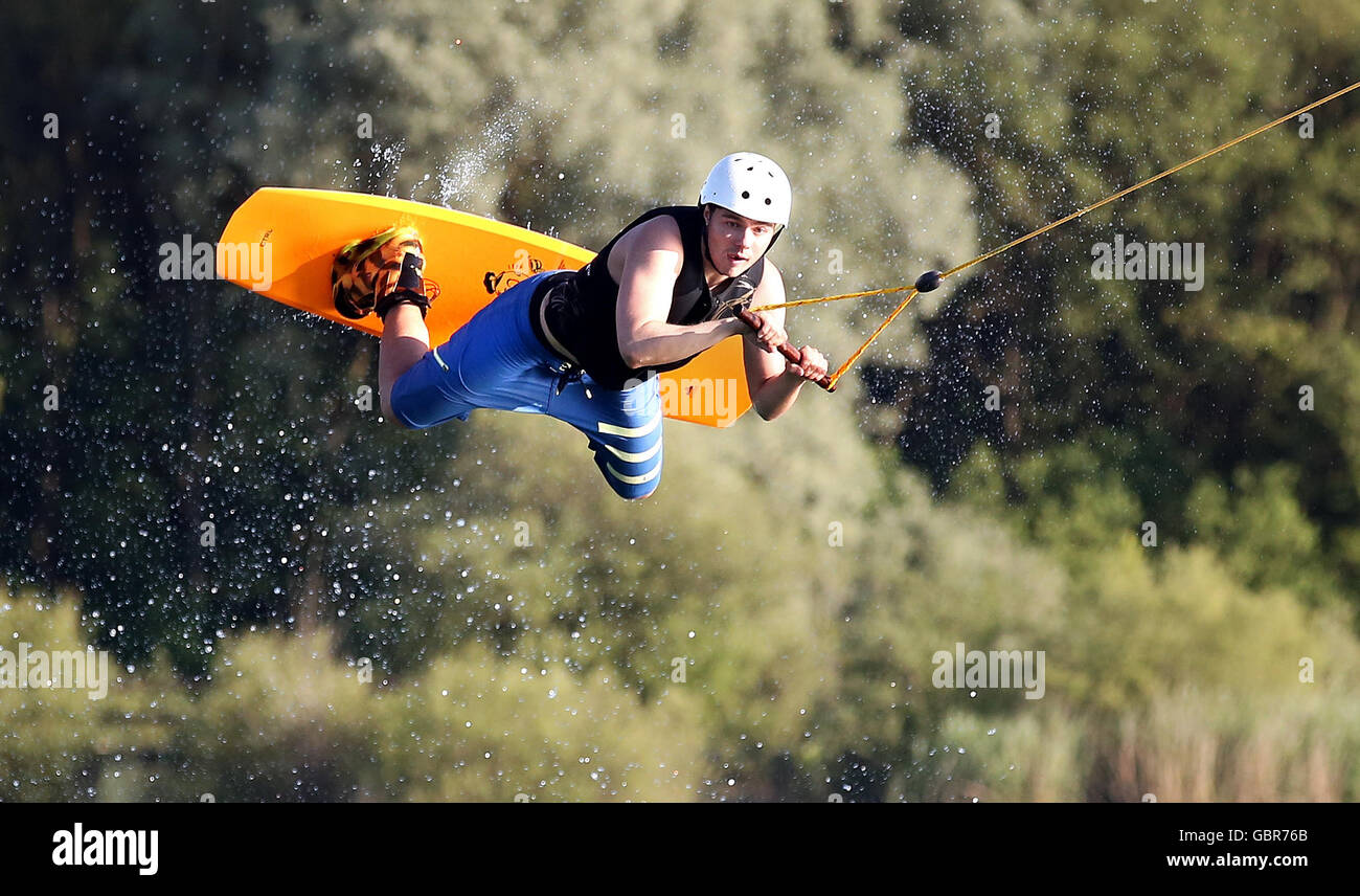 A wakeboarder in action at a waterskiing facility at Seepark Linzgau in Pfullendorf, Germany, 7 July 2016. PHOTO: THOMAS WARNACK/DPA Stock Photo