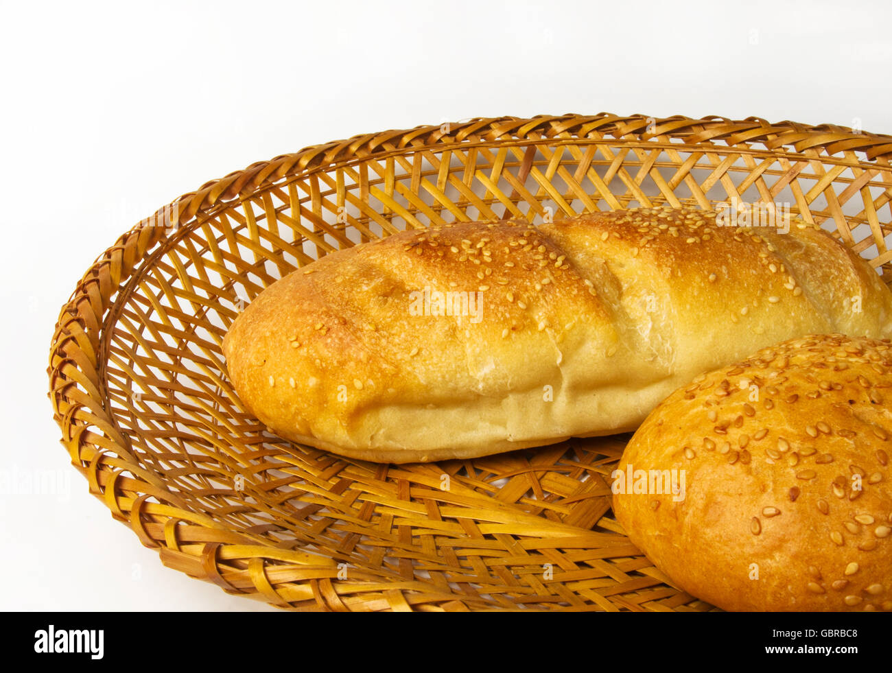 whole wheat bread and bun on a wicker plate Stock Photo - Alamy