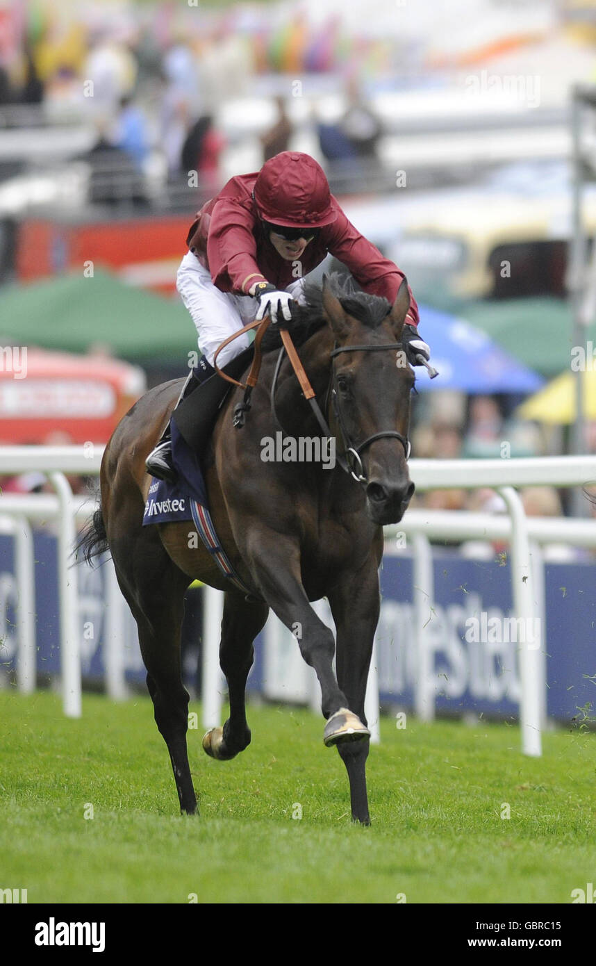 Sariska ridden by Jamie Spencer win The Investec Oaks during The Investec Ladies Day at Epsom Racecourse, London. Stock Photo