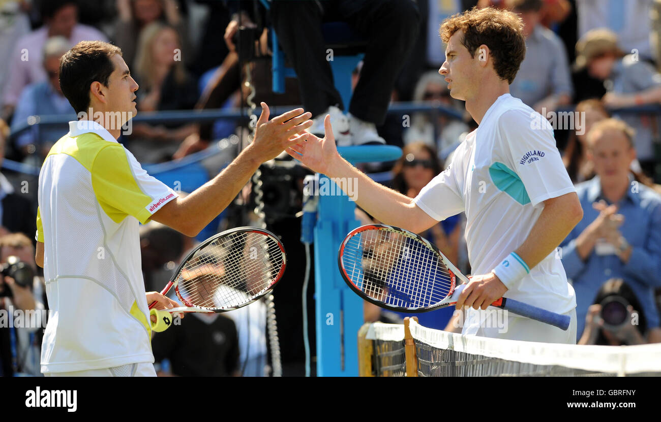 Great Britain's Andy Murray (right) with Spain's Guillermo Garcia-Lopez (left) after his victory during day four of the AEGON Championships at The Queen's Club, London. Stock Photo