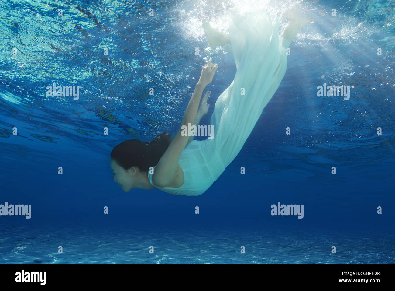 Women swimming underwater hi-res stock photography and images - Alamy