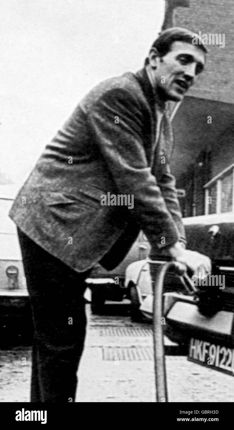 Liverpool's Peter Thompson fills up a car at his garage Stock Photo