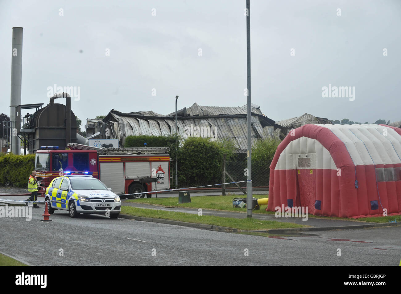 A general view of emergency services at the scene of a fire at an industrial site on Glendower Road, Hereford. Stock Photo