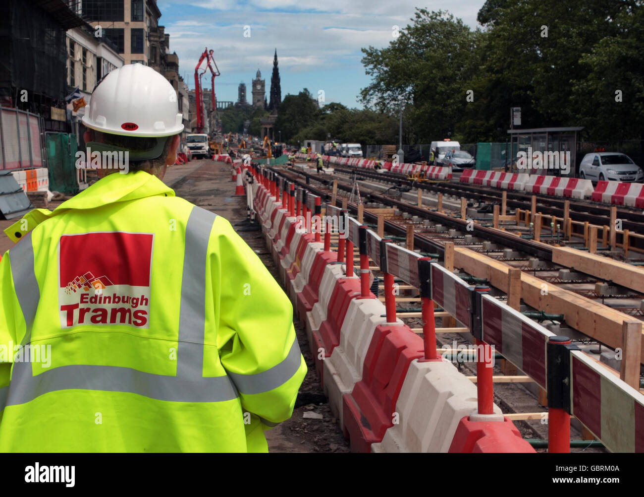 Photo. Tram workers get ready to cement in the new tram line into place on Edinburgh's Princes street. Stock Photo