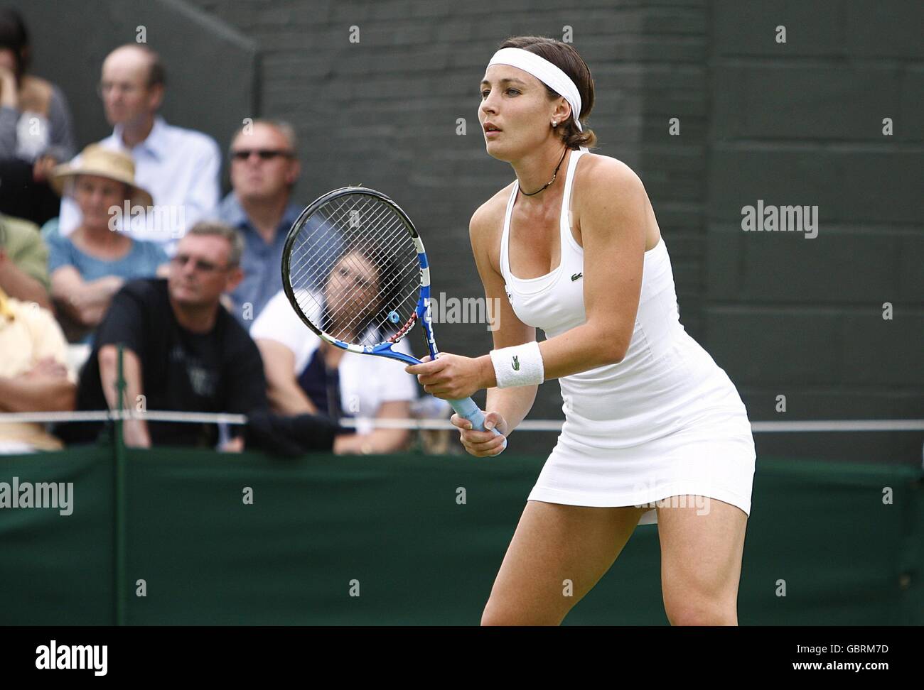 France's Severine Bremond in action against Belarus' Victoria Azarenka during the Wimbledon Championships 2009 at the All England Tennis Club Stock Photo