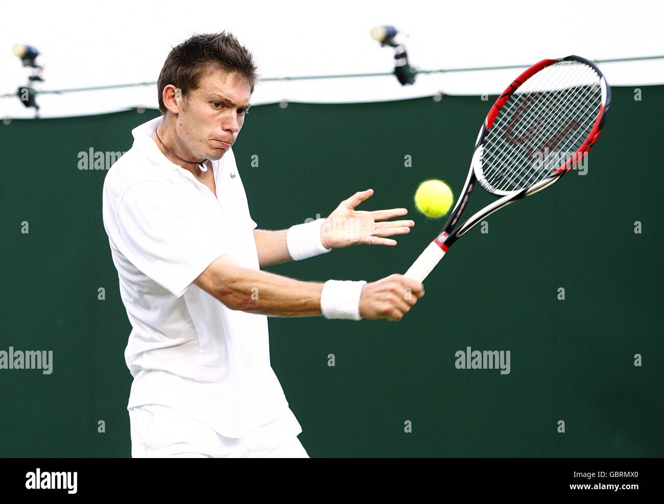 Belgium's Kristof Vliegen in action against France's Nicolas Mahut during  the Wimbledon Championships 2009 at the All England Tennis Club Stock Photo  - Alamy