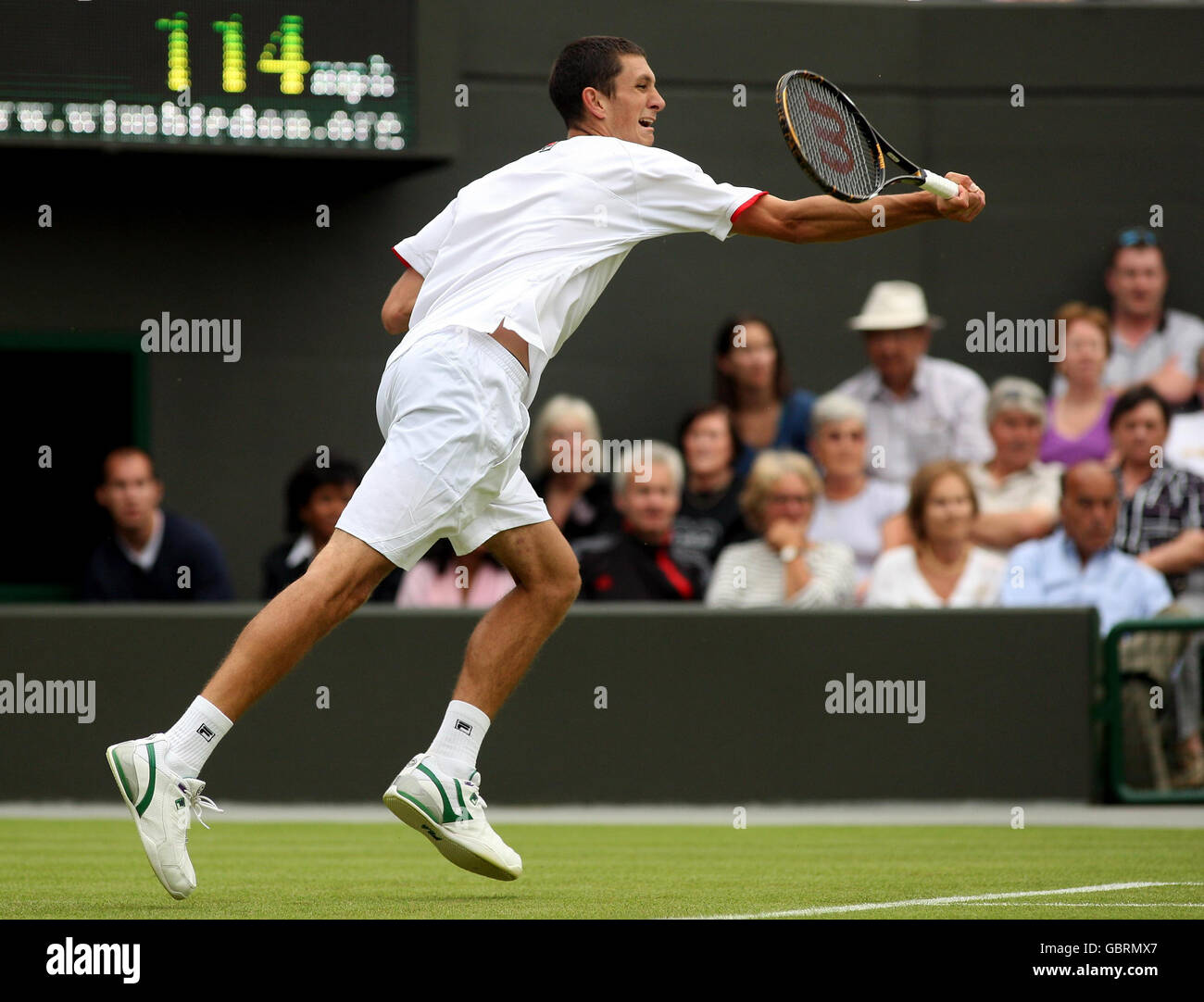 Great Britain's James Ward in action against Spain's Fernando Verdasco during the 2009 Wimbledon Championships at the All England Lawn Tennis and Croquet Club, Wimbledon, London. Stock Photo