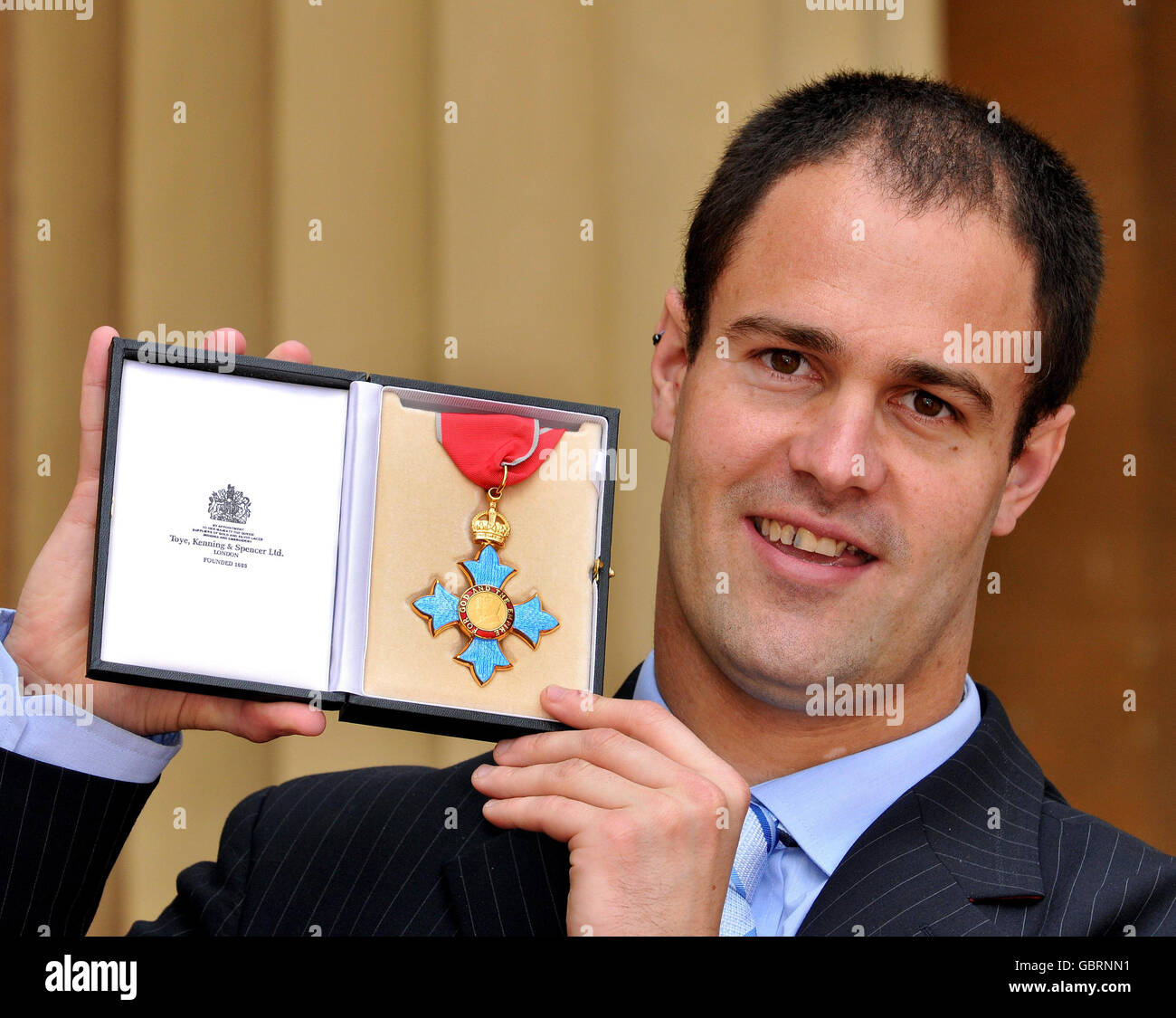 Quadruple Paralympian gold medalist swimmer David Roberts with his CBE