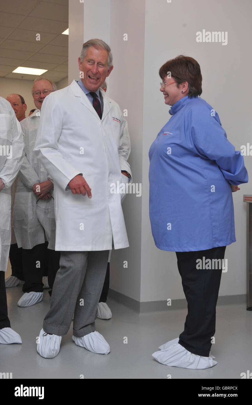 The Prince of Wales talks with Mari Smith (right), who he met in March 1983 in Cardiff, during a tour of the Ortho-Clinical Diagnostics Plant at Pencoed, Mid Glamorgan, Wales dressed in his white protective clothing and shoe covers. Stock Photo