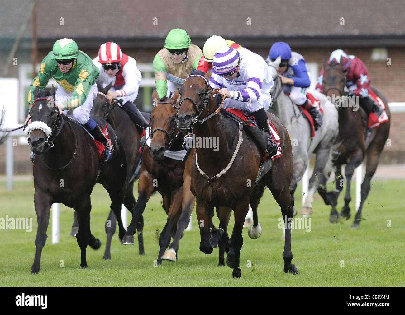Triple Aspect ridden by Liam Jones (right) goes on to win The Agfa Healthcare Scurry Stakes during the Totepool Irish Day at Sandown Racecourse, Esher, Surrey. Stock Photo