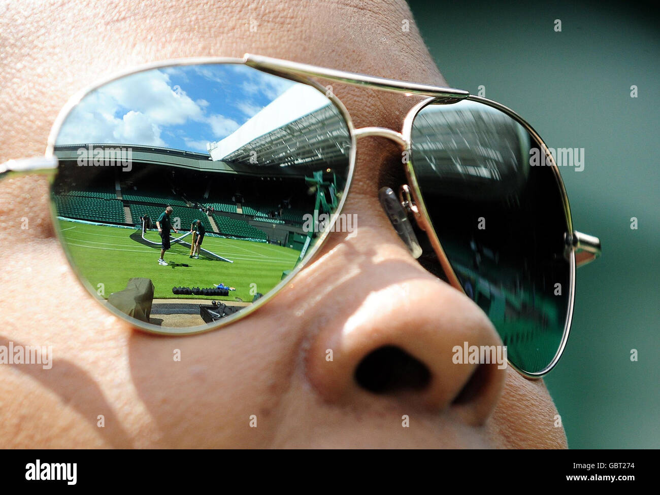 Sunglasses show a reflection of the net being put up on Centre Court at the All England Lawn