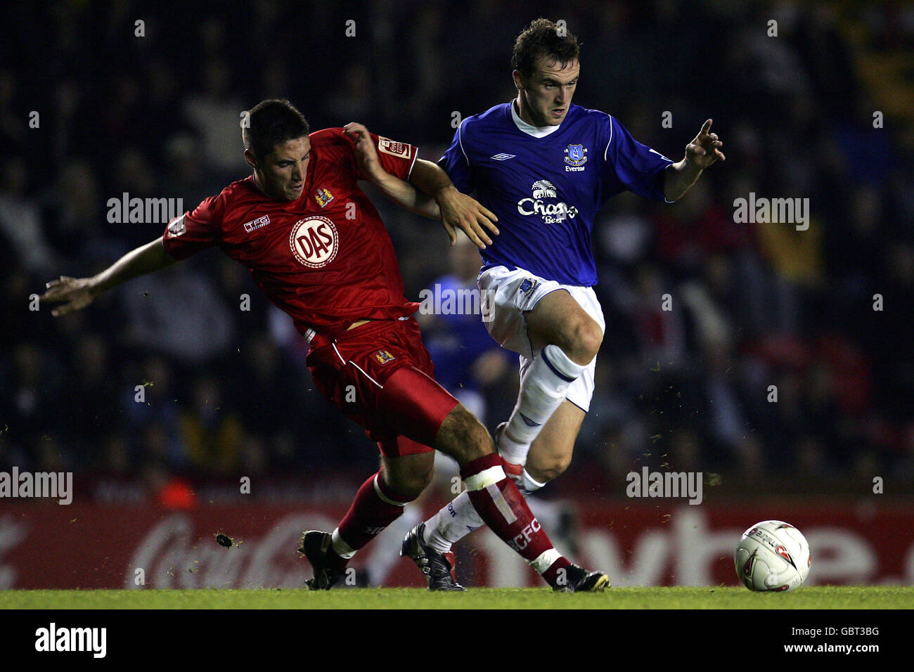 Soccer - Carling Cup - Second Round - Bristol City v Everton. Bristol City's Bradley Orr (l) gets the ball away under pressure from Everton's James McFadden (r) Stock Photo