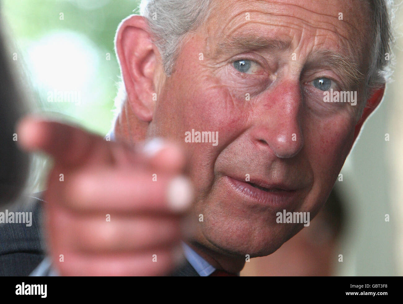 The Prince of Wales looks on during a charity drinks reception at his Welsh property Llwynywormwood in Wales. Stock Photo