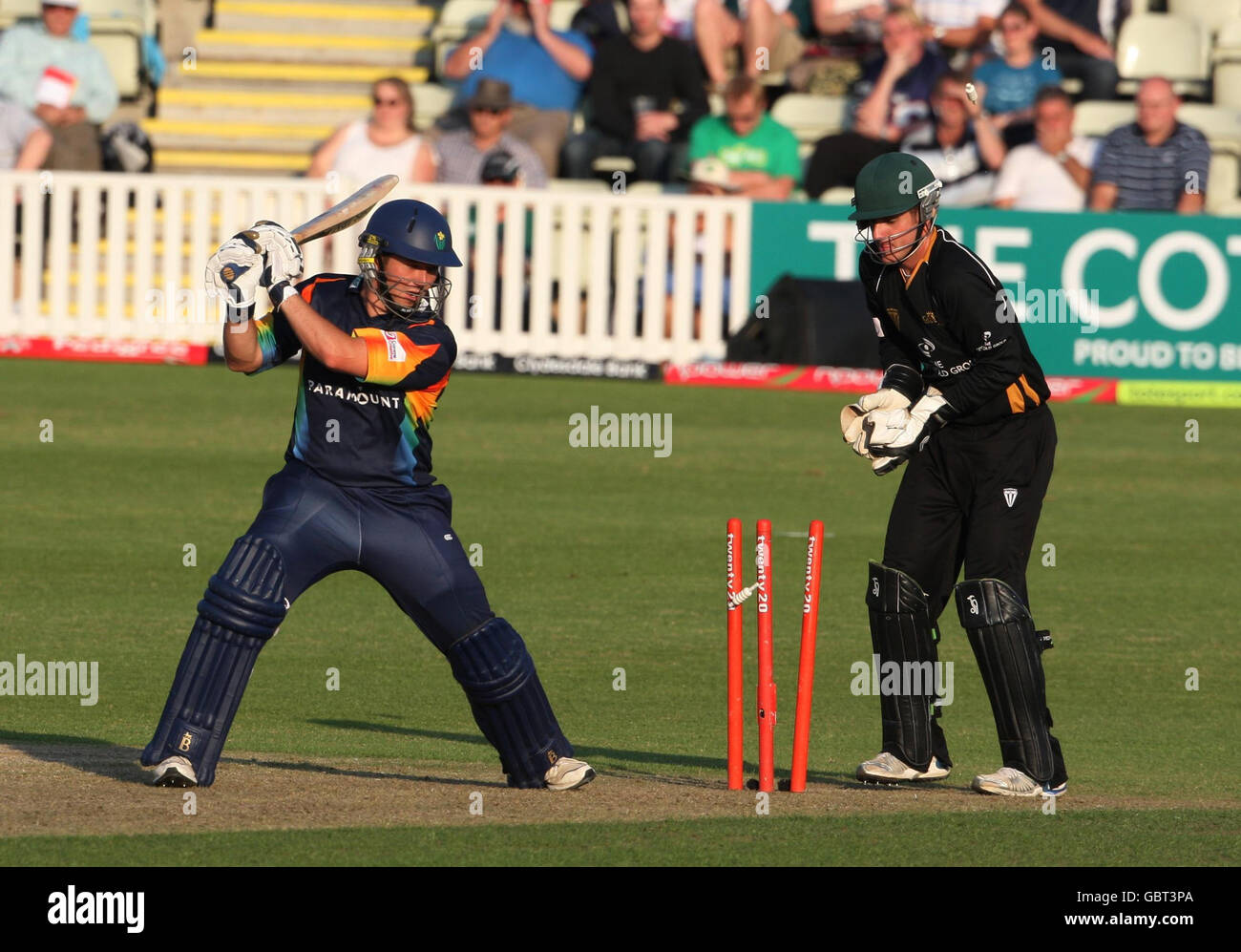 Glamorgan Dragons batsman Ryan Watkins is bowled by Worcestershire Royals Gareth Batty, watched by wicketkeeeper Steven Davies (right) during a Twenty 20 game at the County Ground, Worcester. Stock Photo