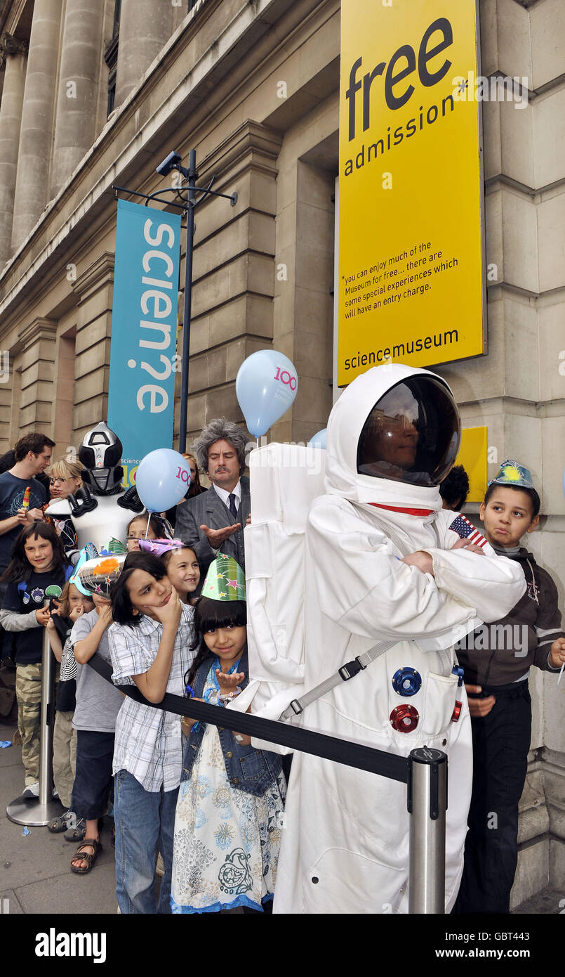 Members of the public, with some special guests, queue outside the