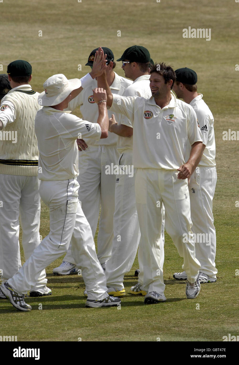 The Australian team celebrate after taking the wicket of Sussex's Michael Yardy (not pictured) off the bowling of Australia's Ben Hilfenhaus (second right) during the tour match at the County Ground, Sussex. Stock Photo