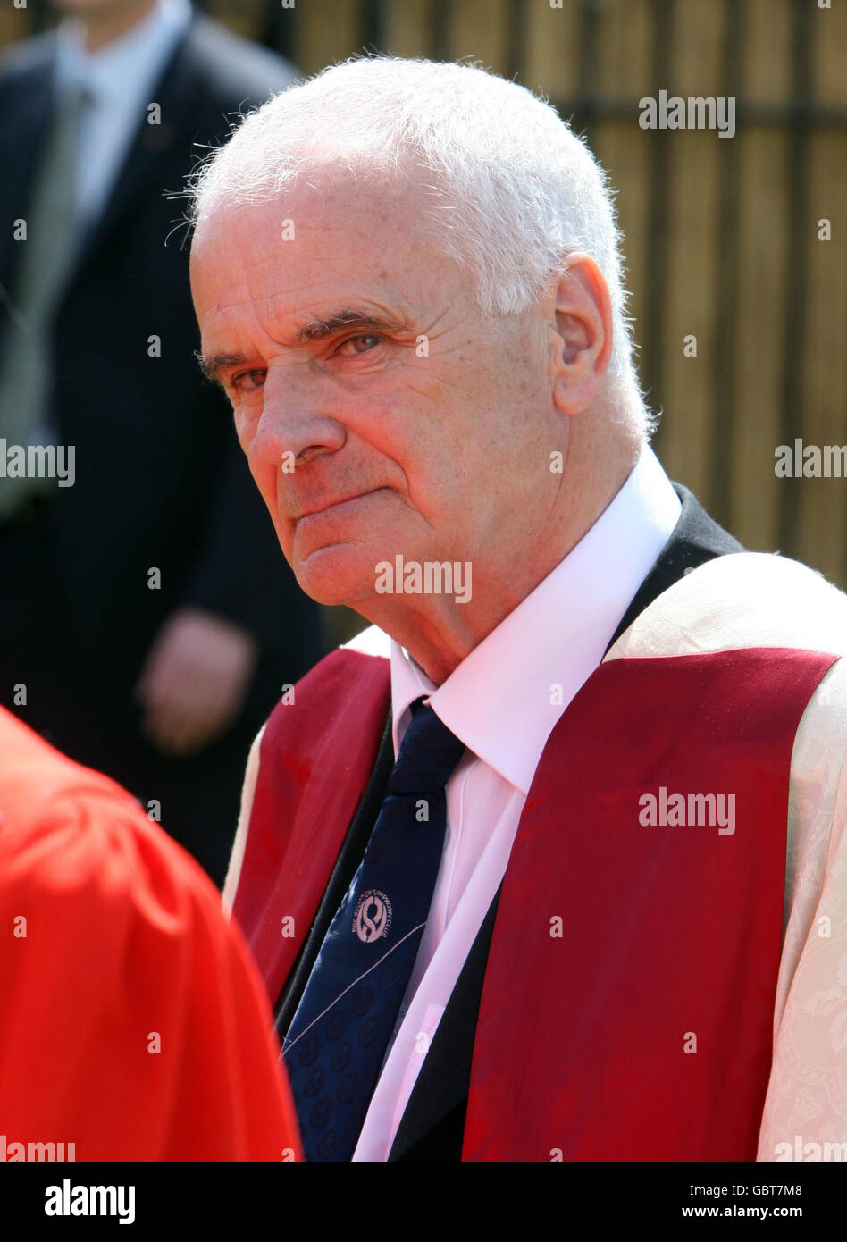 Master of the Queens Music Sir Peter Maxwell Davies, walks in a procession at the Senate House at Cambridge University, before being made an honorary Doctor of Music during a ceremony at the University. Stock Photo