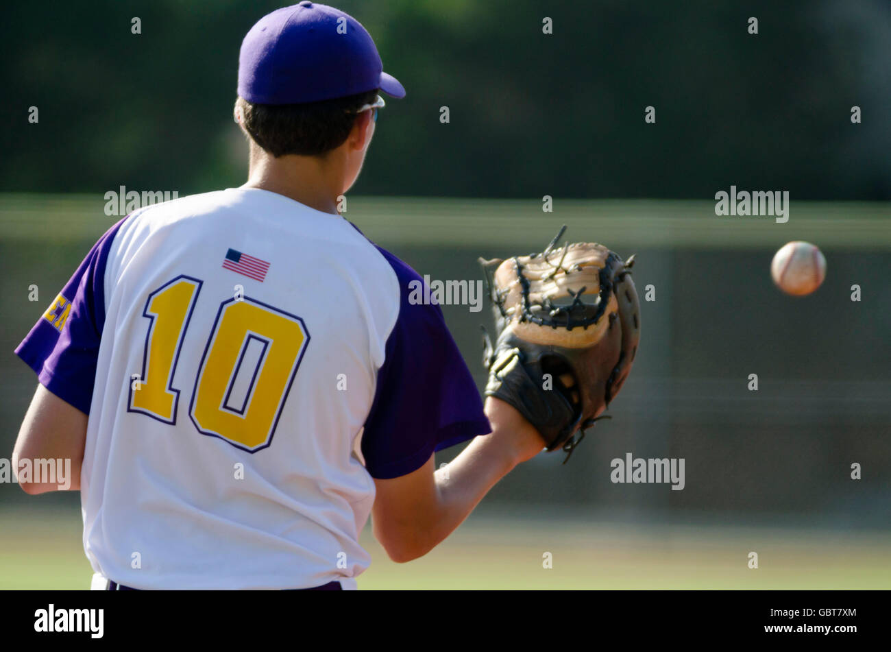 baseball player catching ball Stock Photo
