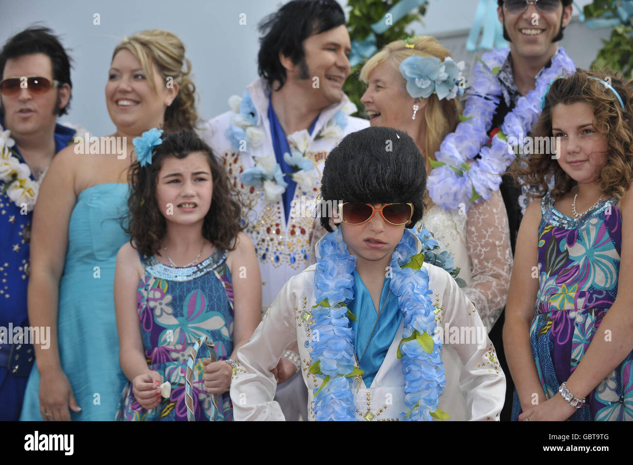 Rhys Berry, aged nine, who is Britain's youngest Elvis tribute artist at the wedding of Steve and Barbara Caprice after the couple's civil ceremony wedding in Porthcawl, Wales. The ceremony was a faithful recreation of the wedding scene from Elvis' Blue Hawaii film. Stock Photo