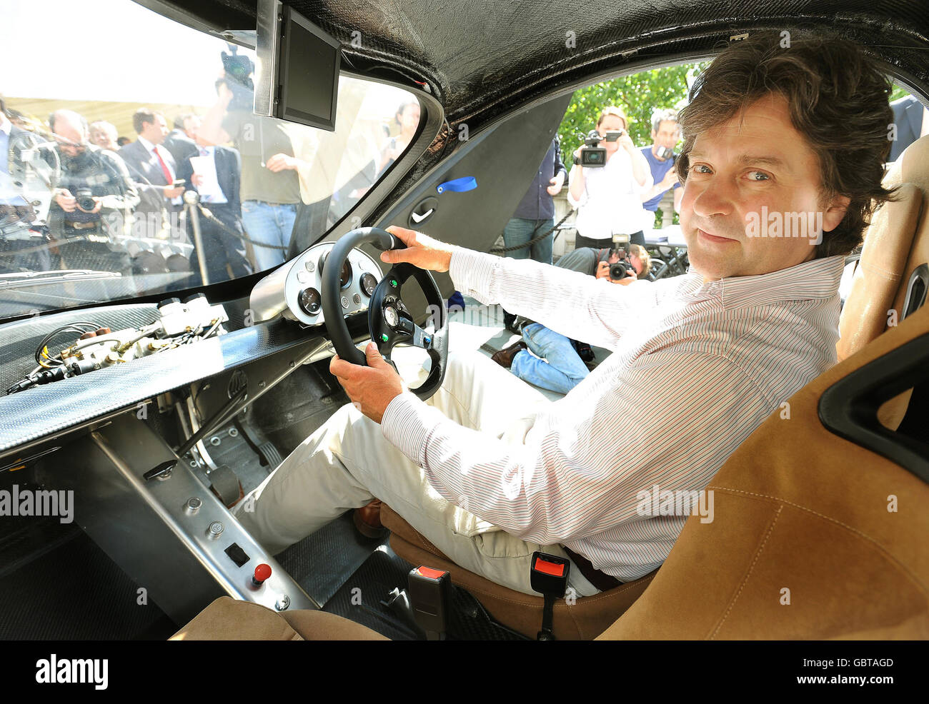 Hugo Spowers, the founder and brains behind the Riversimple hydrogen-powered car, sits behind the wheel as it makes it's debut in central London. Stock Photo