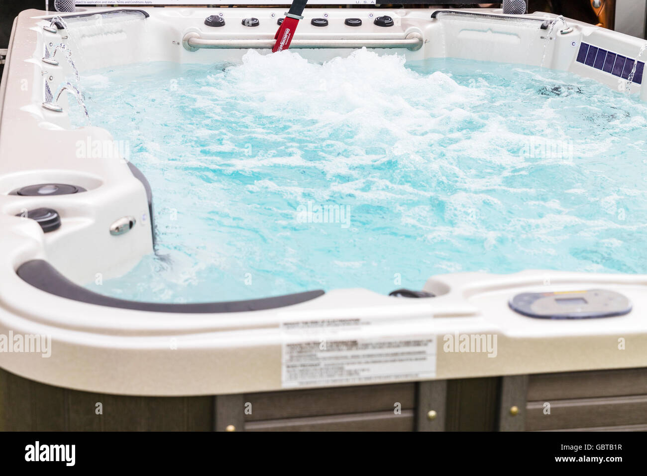 Hot tub water bubbling tubs jets blowing bubbles to sooth aches and pains  UK England GB Stock Photo - Alamy