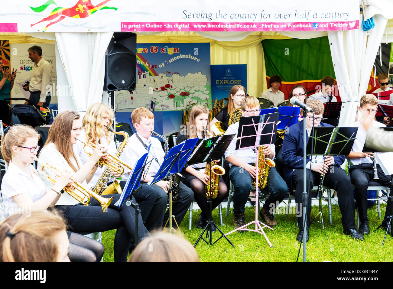 Brass band kids playing instruments trumpet saxophone players UK