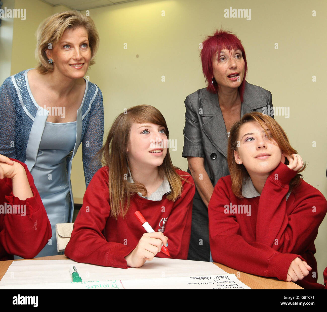 The Countess of Wessex speaks to pupils and Hilary Pannack, Chief Executive of Straight Talking during a visit to Whitton School and Sports College, in Twickenham, which helps teenage mothers with the practicalities of being a parent. Stock Photo