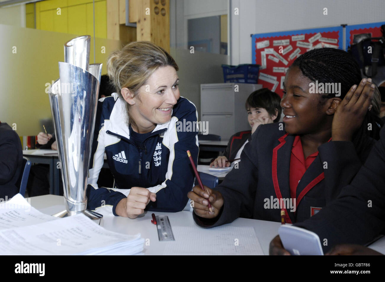Charlotte Edwards, England Women's Cricket Captain, gives advice to Shannel Caleb-Carter, aged 12, at Mossbourne Community Academy in Hackney, east London during the Cricket Foundation's Chance to shine National Cricket Day. Stock Photo